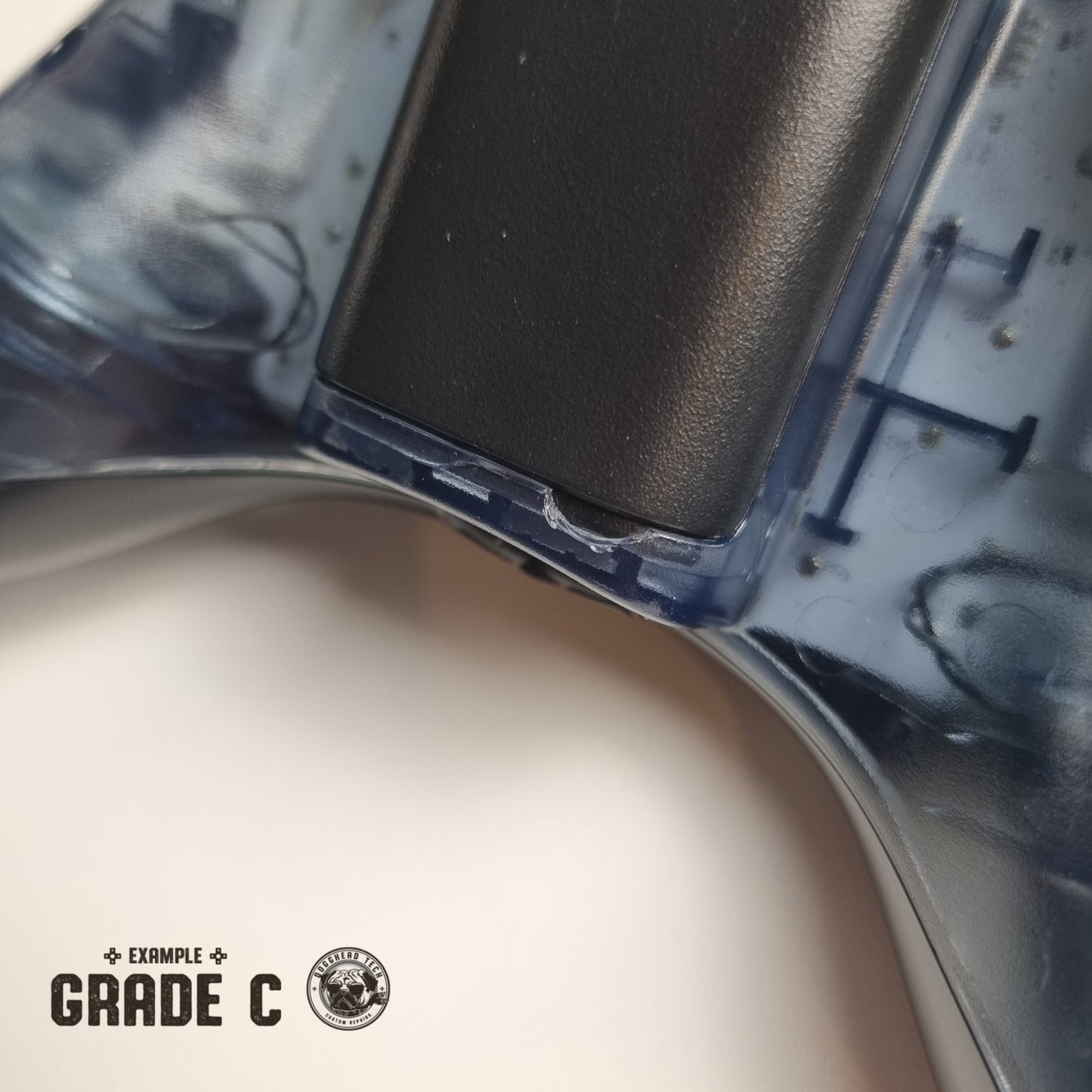 Official Xbox 360 'Halo 4: Forerunner' controller showing broken plastic with text in the bottom left corner of the image that reads "Example Grade C"
