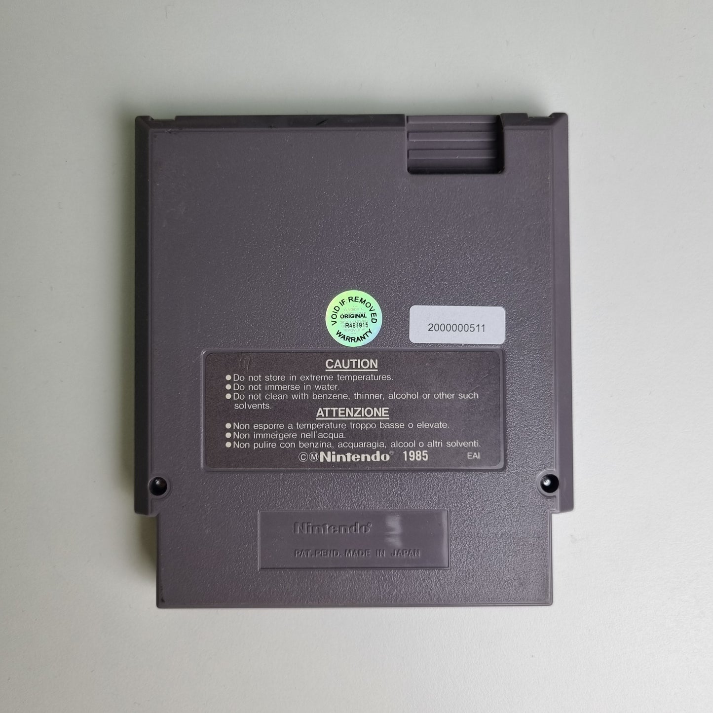 Back of a Nintendo NES game cartridge on a light grey background
