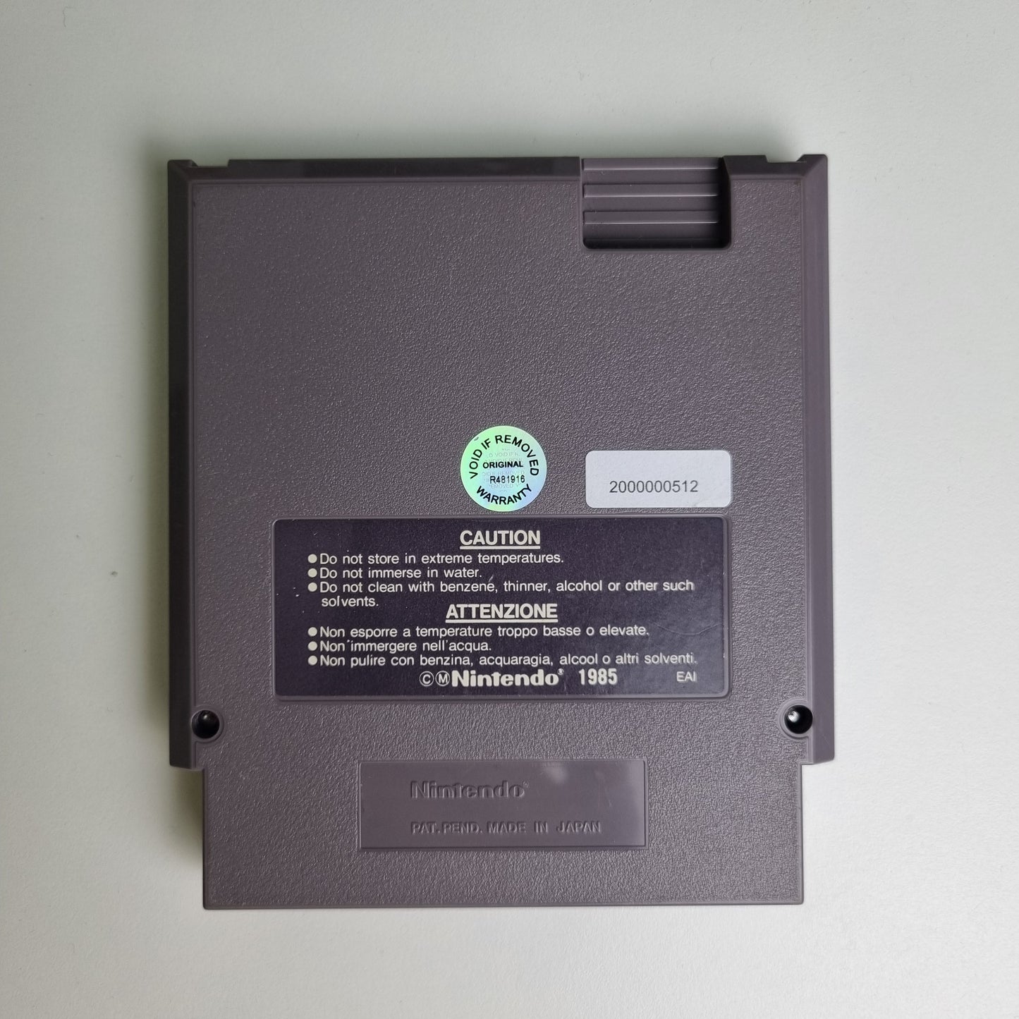Back of a Nintendo NES game cartridge on a light grey background