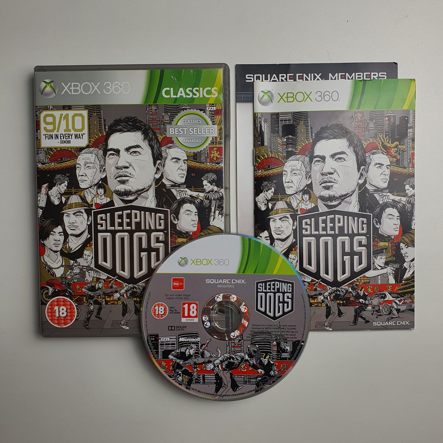 'Sleeping Dogs' game disc, case and manual for Xbox 360 on a grey background