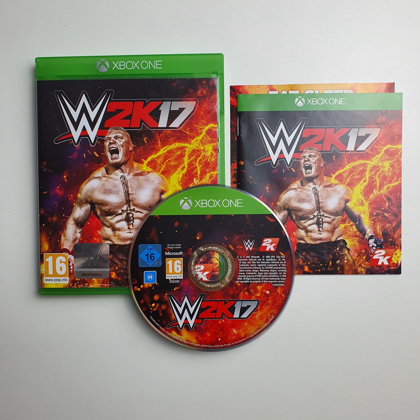 WWE 2K17 game case, disc and manual on a white background