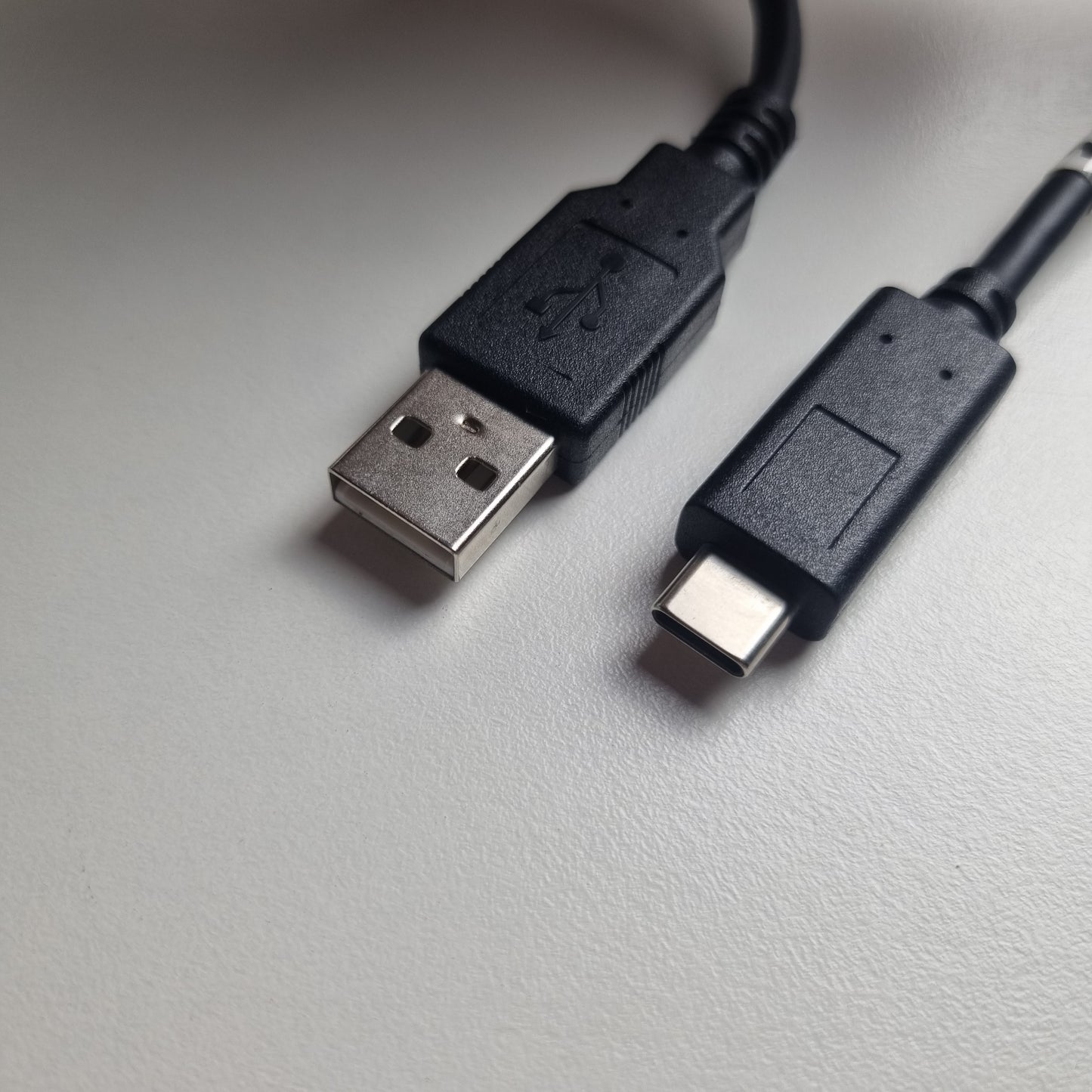 The USB-A and USB-C ends of a Honeywell singular charging cable on a white background