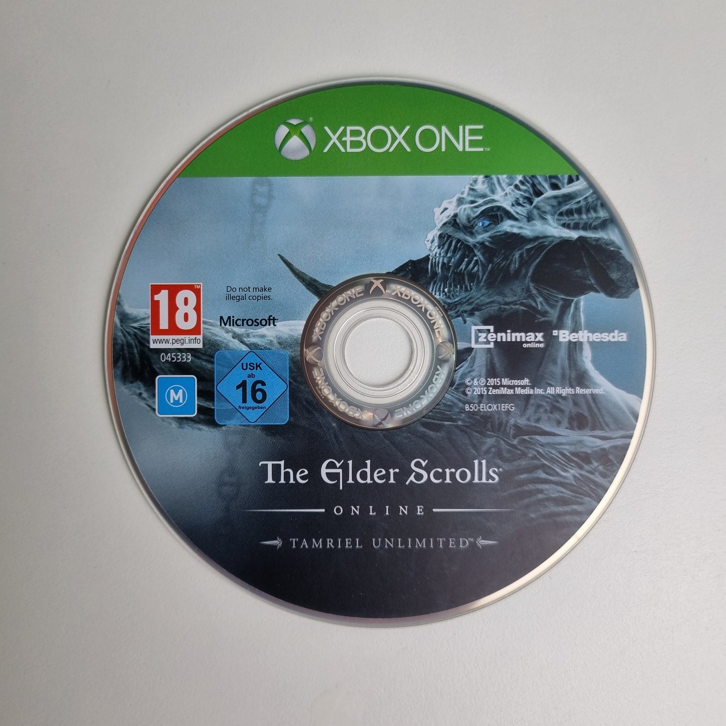 Xbox One game disc for 'The Elder Scrolls Online' Tamriel Unlimited on a grey background