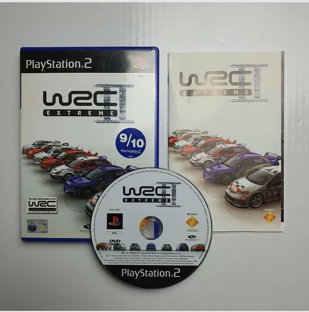 PlayStation 2 game disc, case and manual for the game WRC II Extreme, with the cover displaying the game title and car graphics.