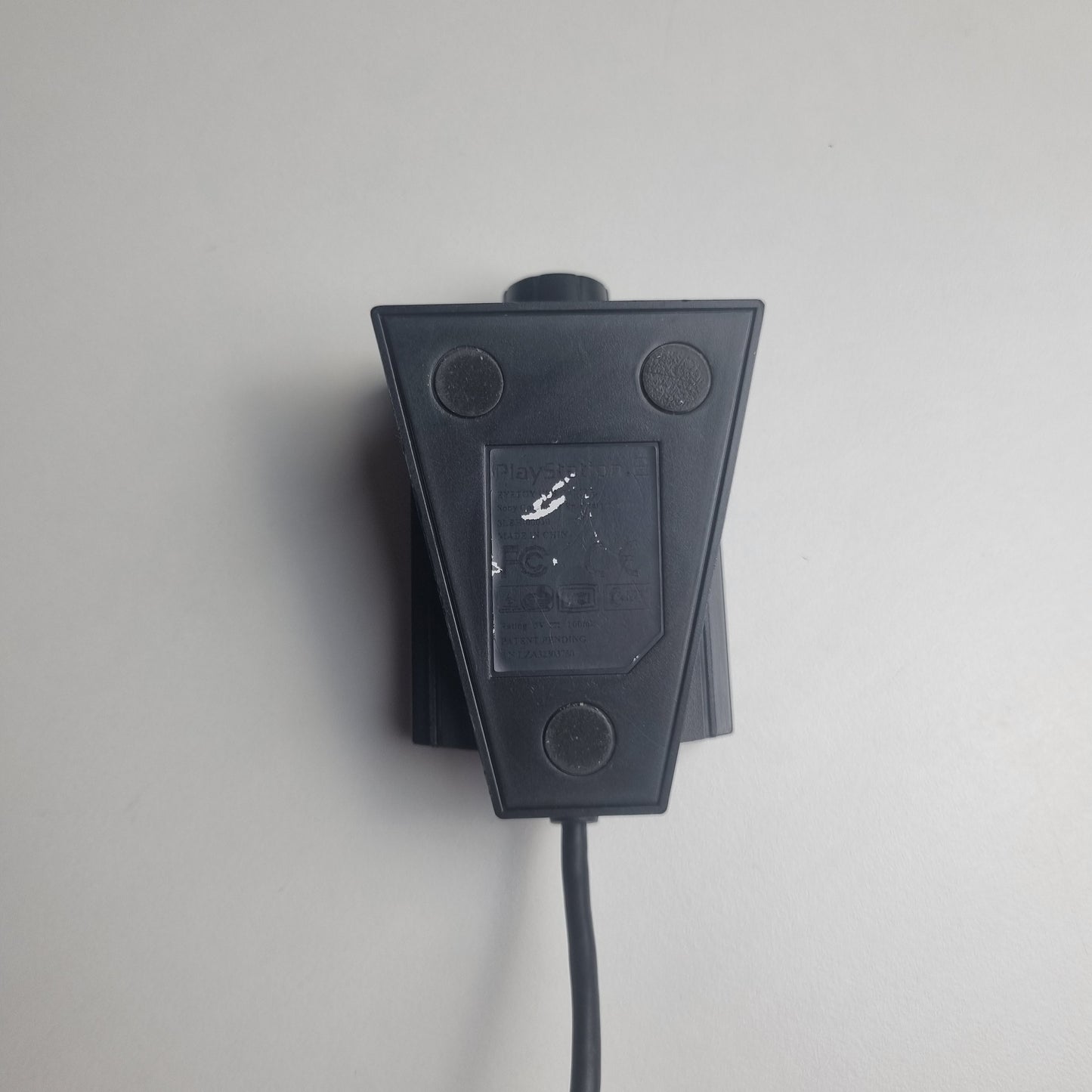 Bottom of a refurbished PlayStation 2 EyeToy camera on a white background.