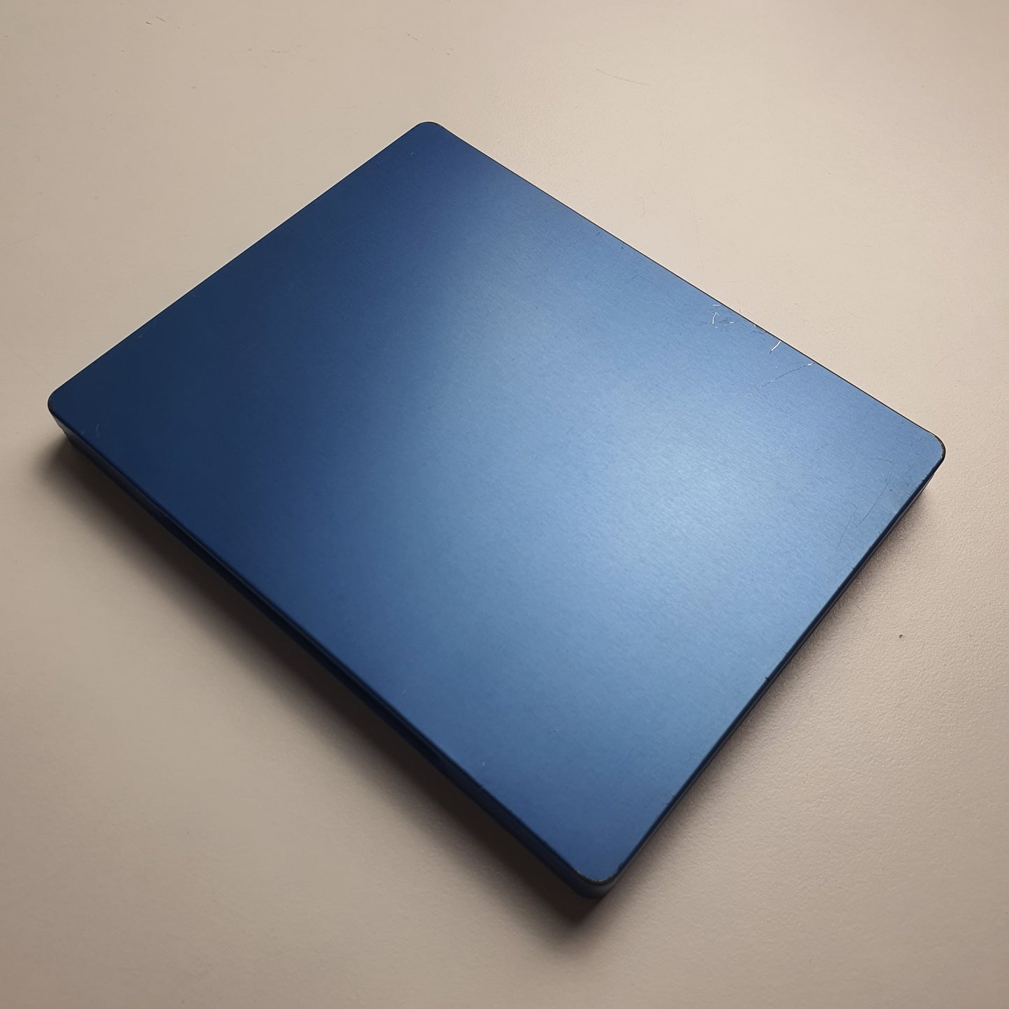 Blue back of a steelbook game case for Fallout 76