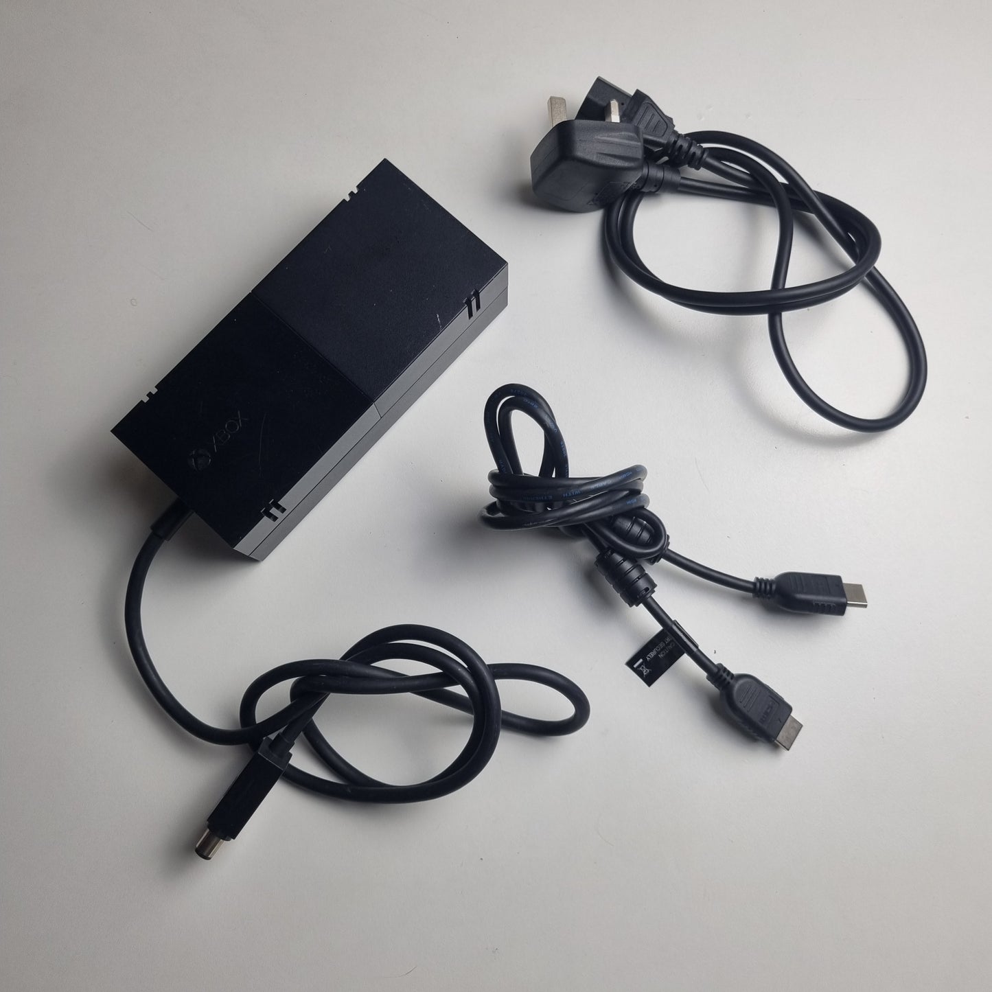 Power supply and display cables for an official Microsoft Xbox One refurbished console limited edition Halo 5: Guardians 1 terabyte