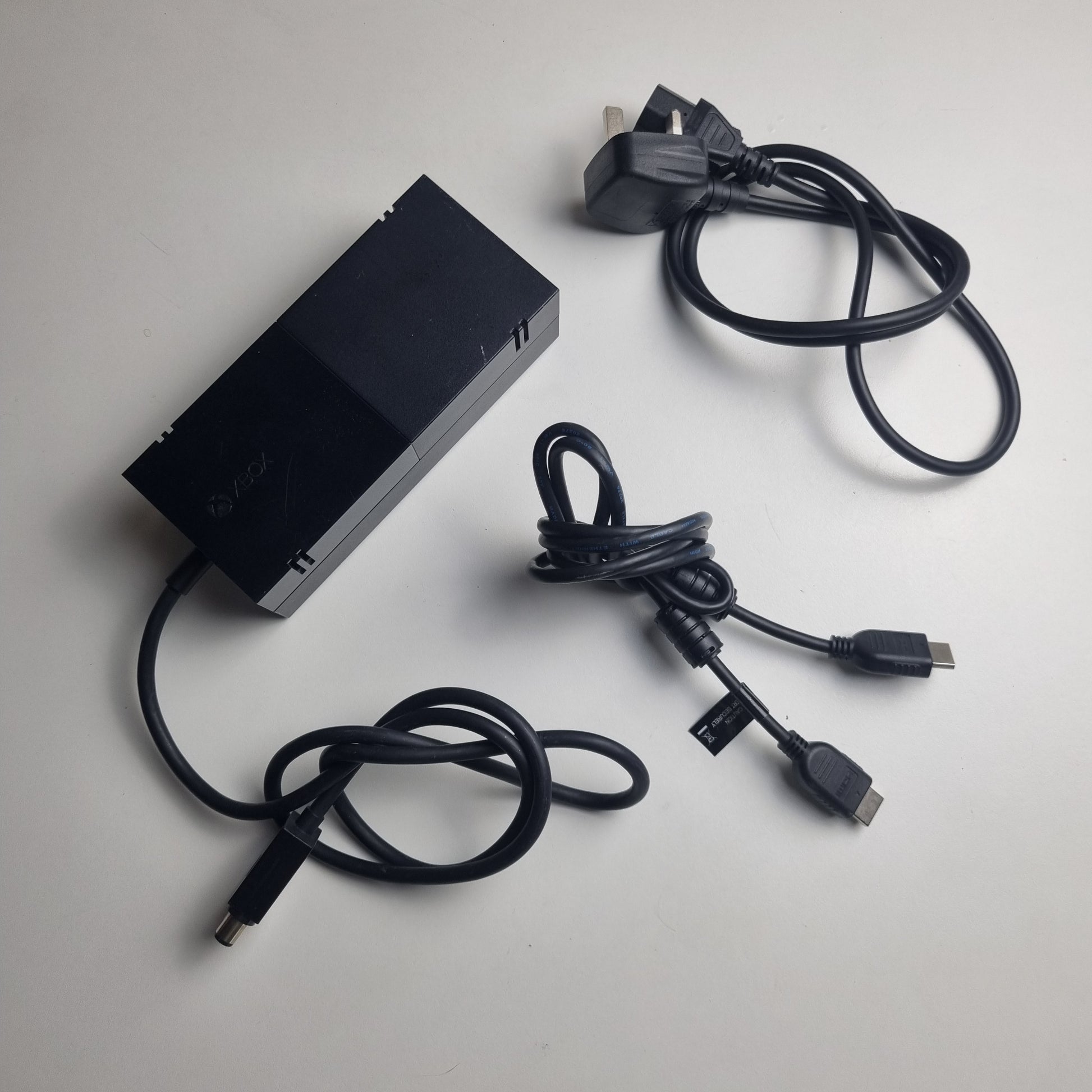 Power supply and display cables for an official Microsoft Xbox One refurbished console limited edition Halo 5: Guardians 1 terabyte