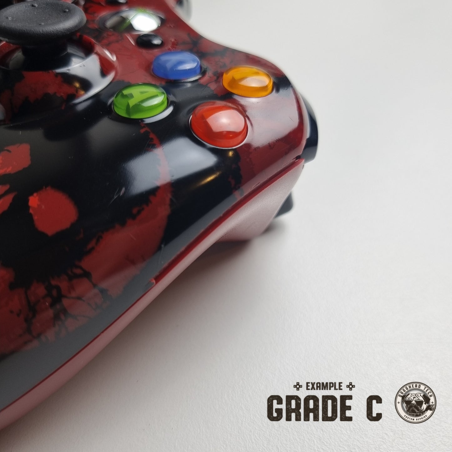 Official Xbox 360 'Gears of War 3' controller showing broken plastic down its side with text in the bottom right corner of the image that reads "Example Grade C".