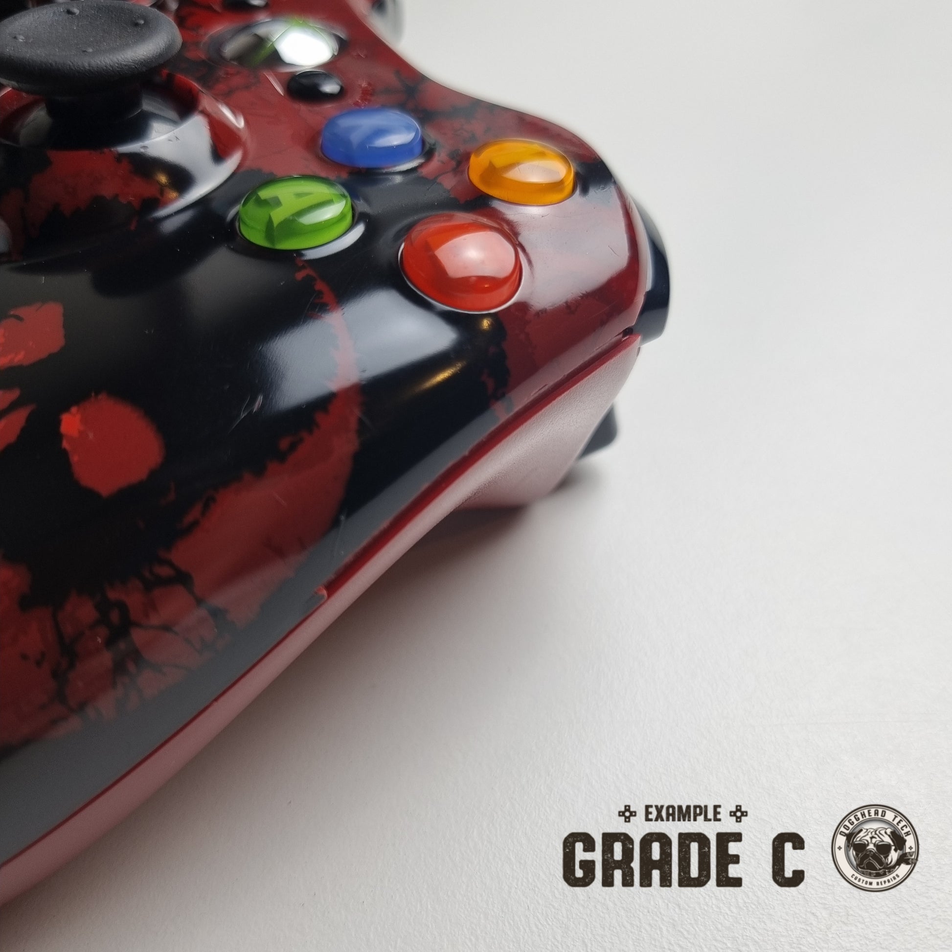 Official Xbox 360 'Gears of War 3' controller showing broken plastic down its side with text in the bottom right corner of the image that reads "Example Grade C".