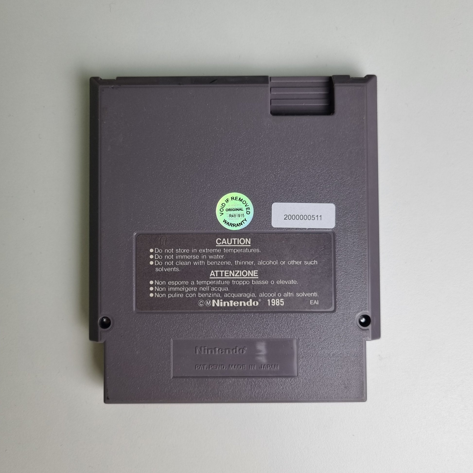 Back of a Nintendo NES game cartridge on a light grey background