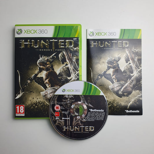 Hunted game case, manual and disc on a grey background