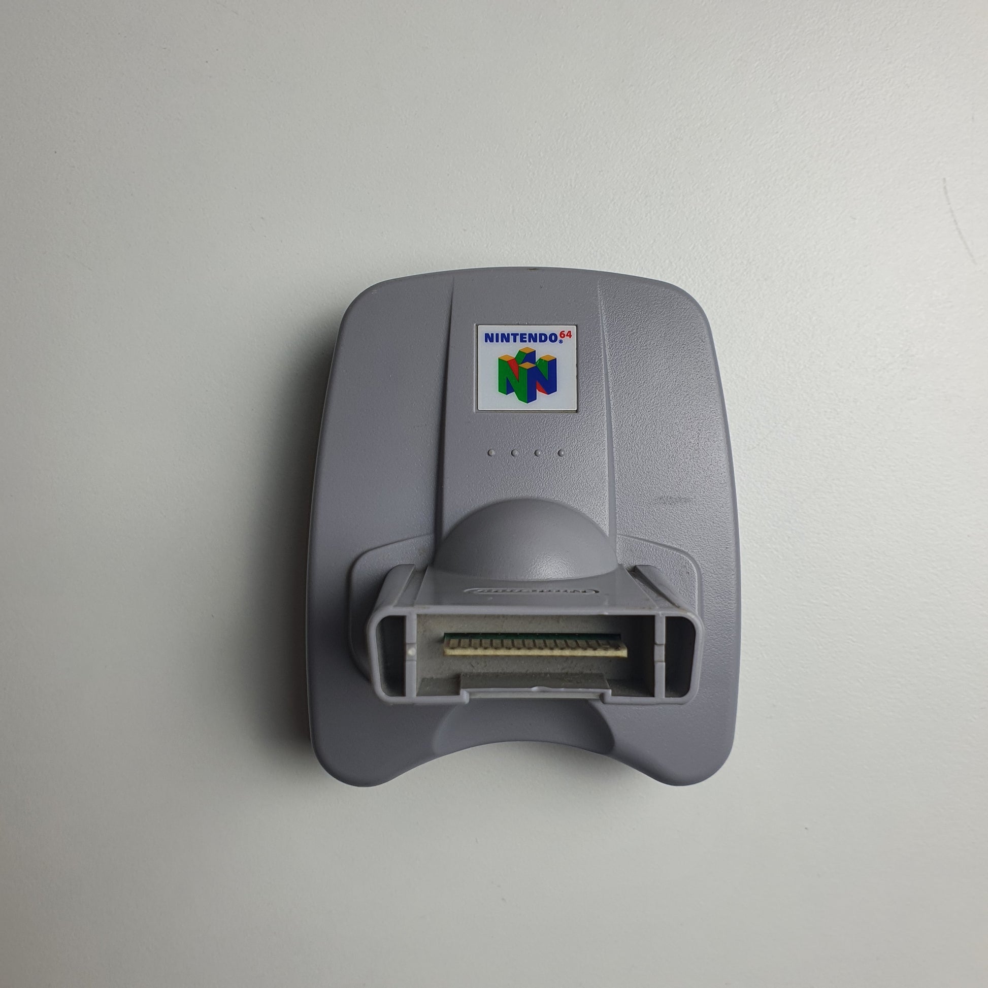 Nintendo 64 N64 transfer pak on a white background