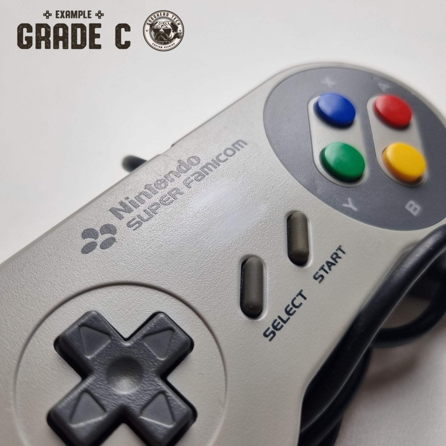 Close up of an official Nintendo SNES Super Famicom Japanese refurbished controller on a white background