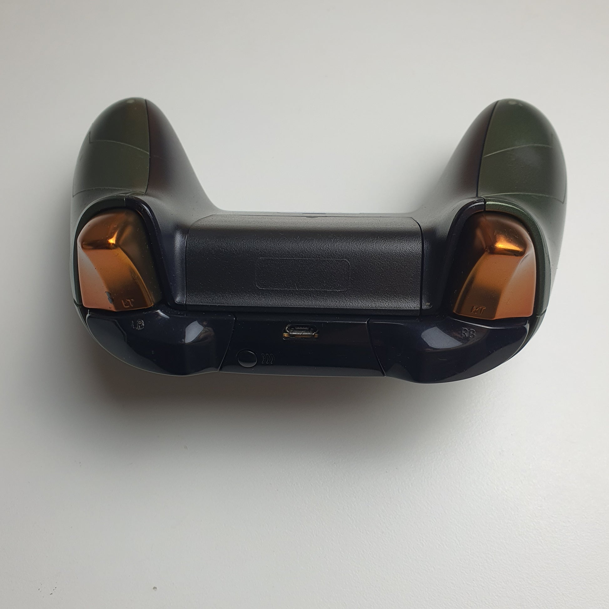 Top of a green & copper coloured Xbox One 'Master Chief' controller on a white background