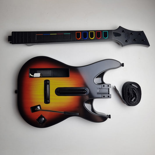 Official RedOctane Nintendo Wii sunburst guitar controller with strap on a white background.