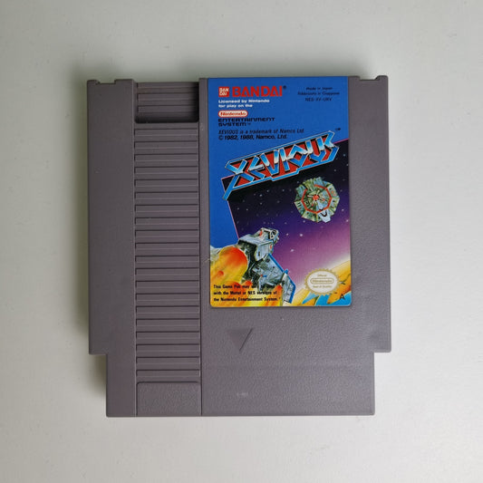 Nintendo NES game cartridge for 'Xevious' on a white background