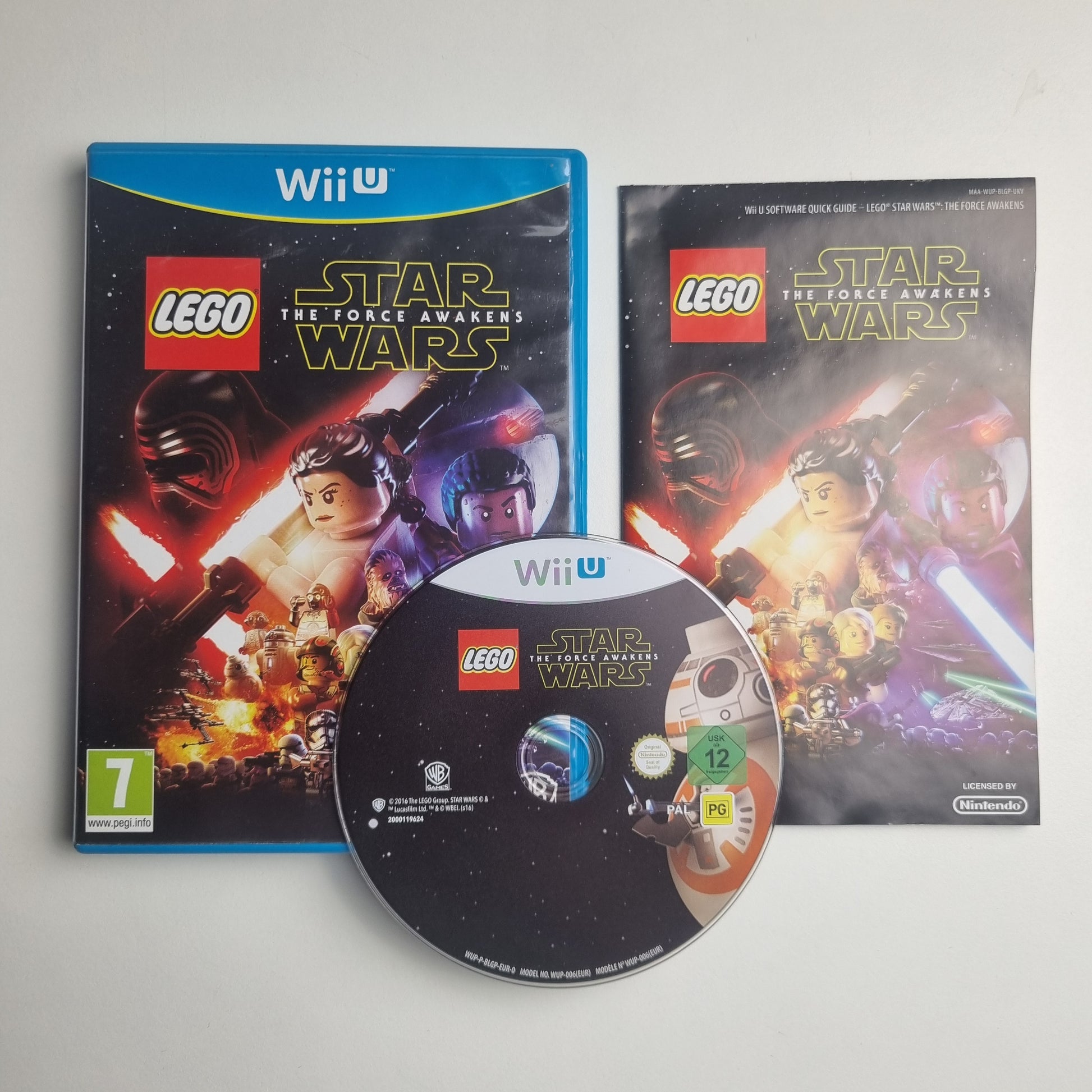 Nintendo Wii U game disc, case and manual for 'LEGO Star Wars: The Force Awakens' on a white background.