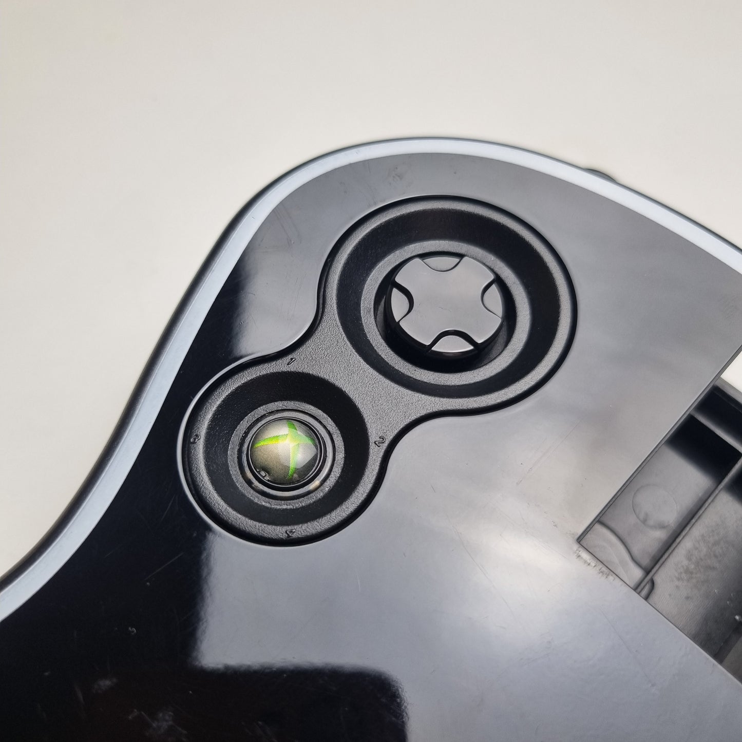 Close-up of buttons of a official RedOctane Xbox 360 Gibson Les Paul black guitar controller on a white background.