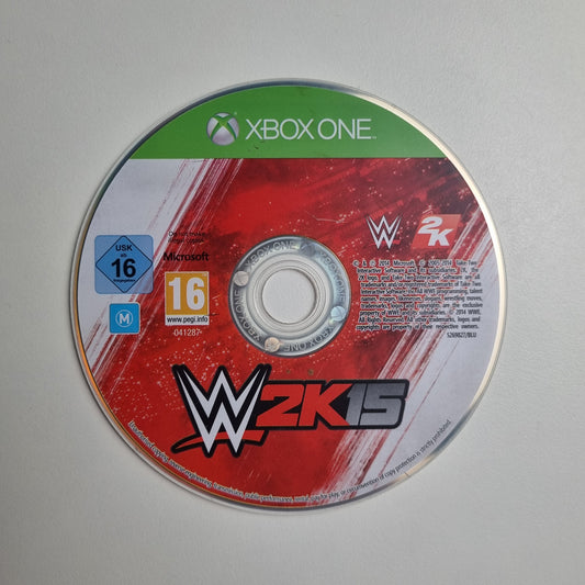 WWE 2K15 game disc for Xbox One on a grey background