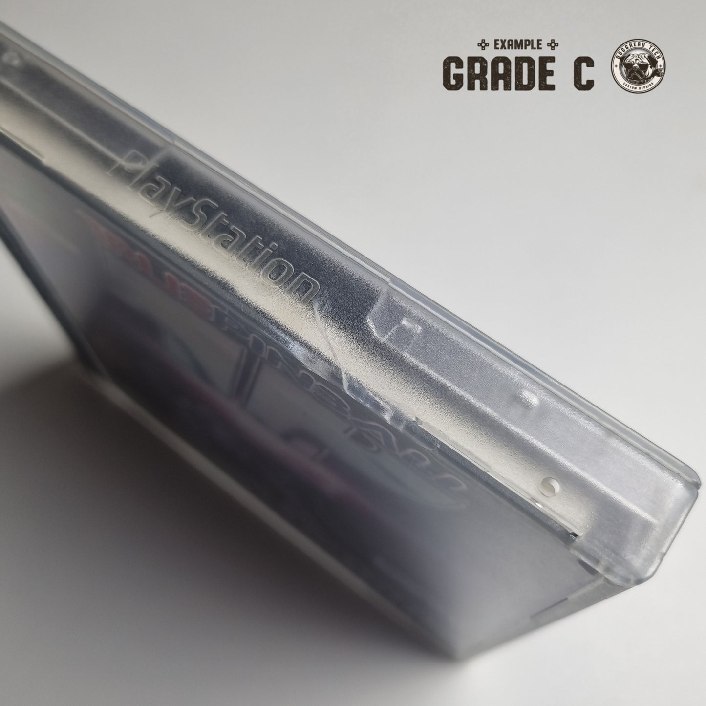 PlayStation PS1 game case showing a crack, with text in the top right corner that reads "Example Grade C" on a white background.