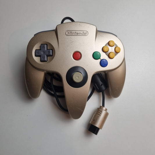 Refurbished modified gold Nintendo 64 controller on a light grey background.