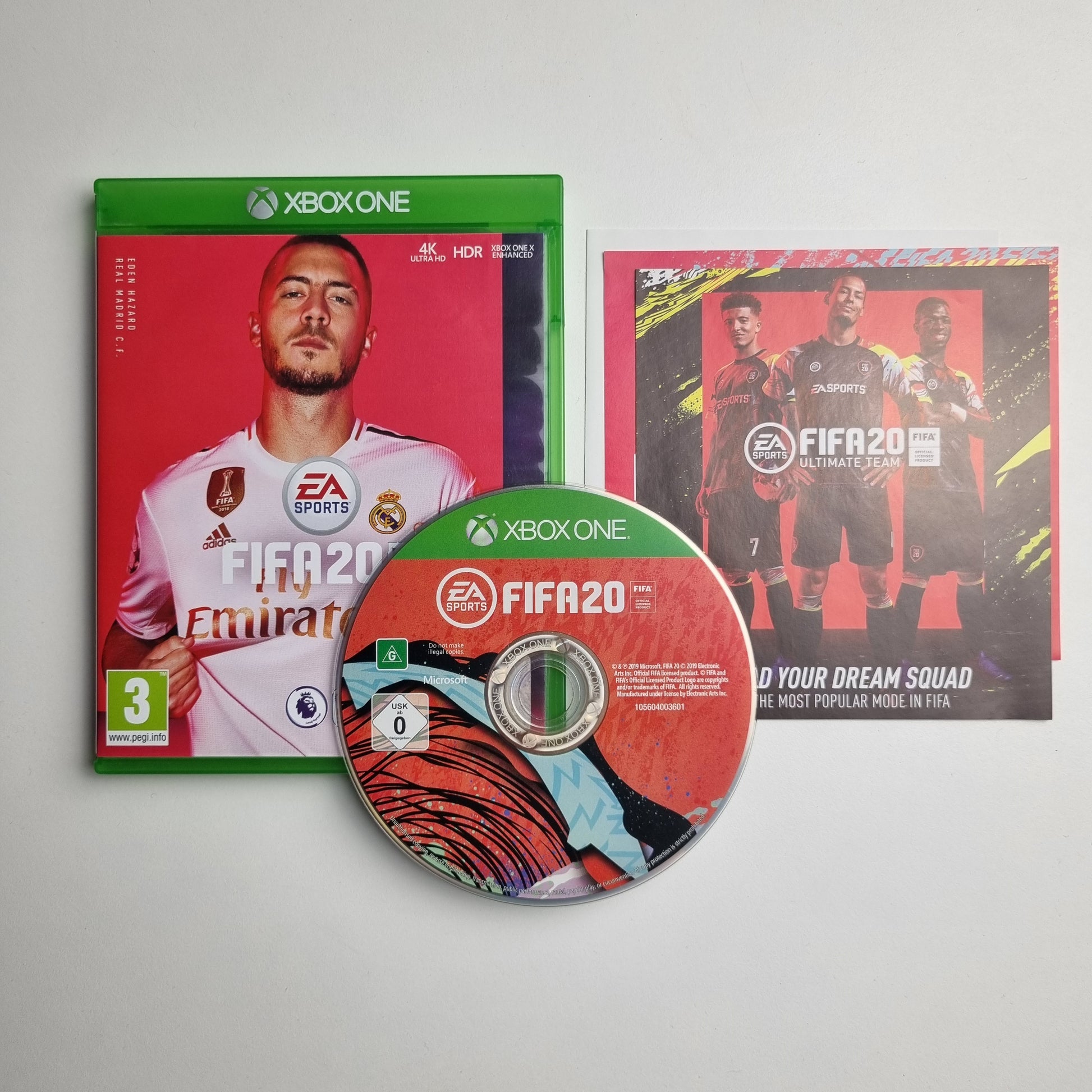 Xbox One game case, disc and inserts for 'FIFA 20' on a light grey background