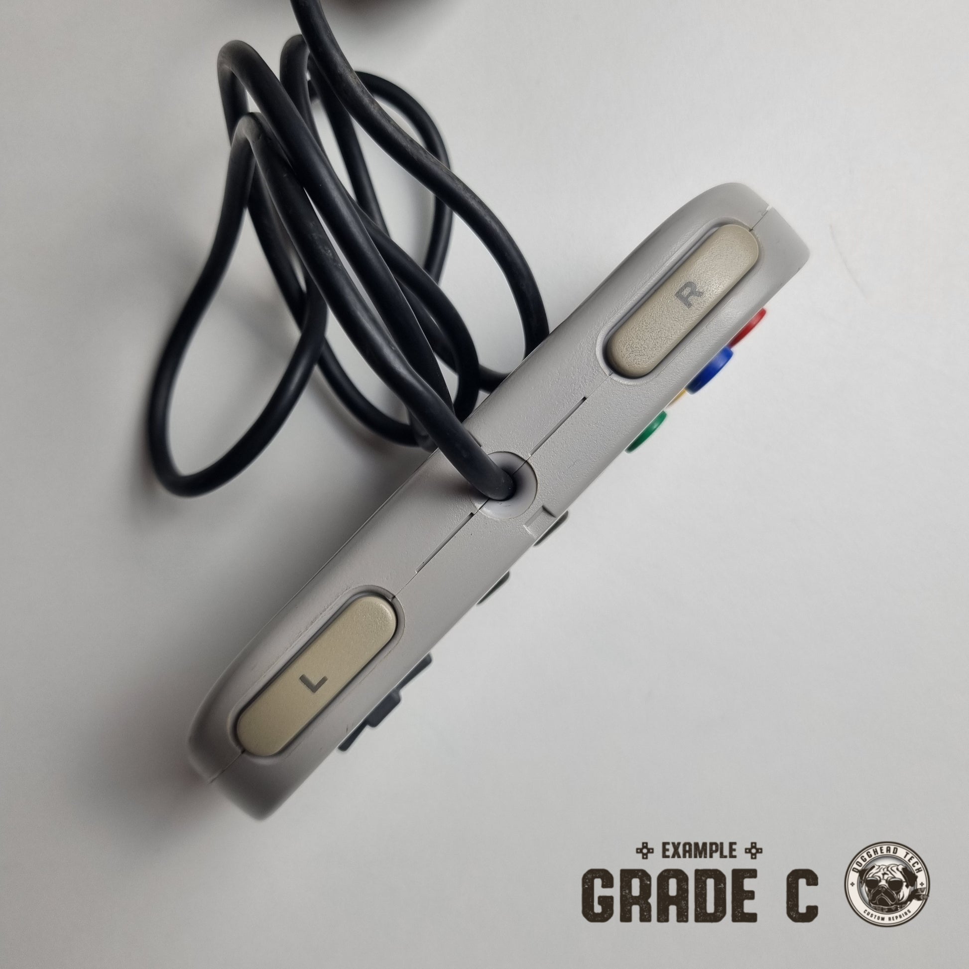 Top view of an official Nintendo SNES Super Famicom Japanese refurbished controller on a white background