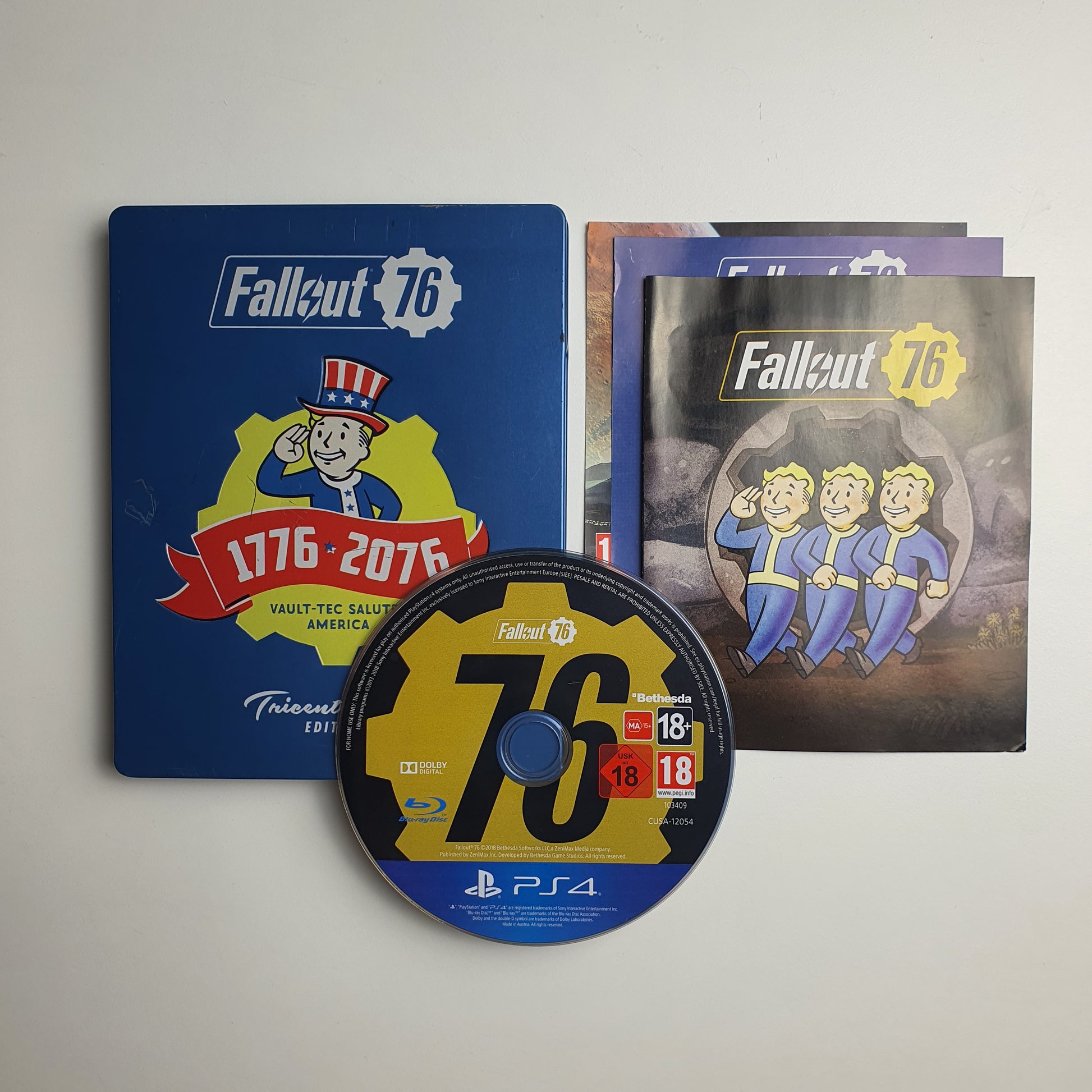 Fallout 76 blue steelbook, including inserts, game case and game disc.