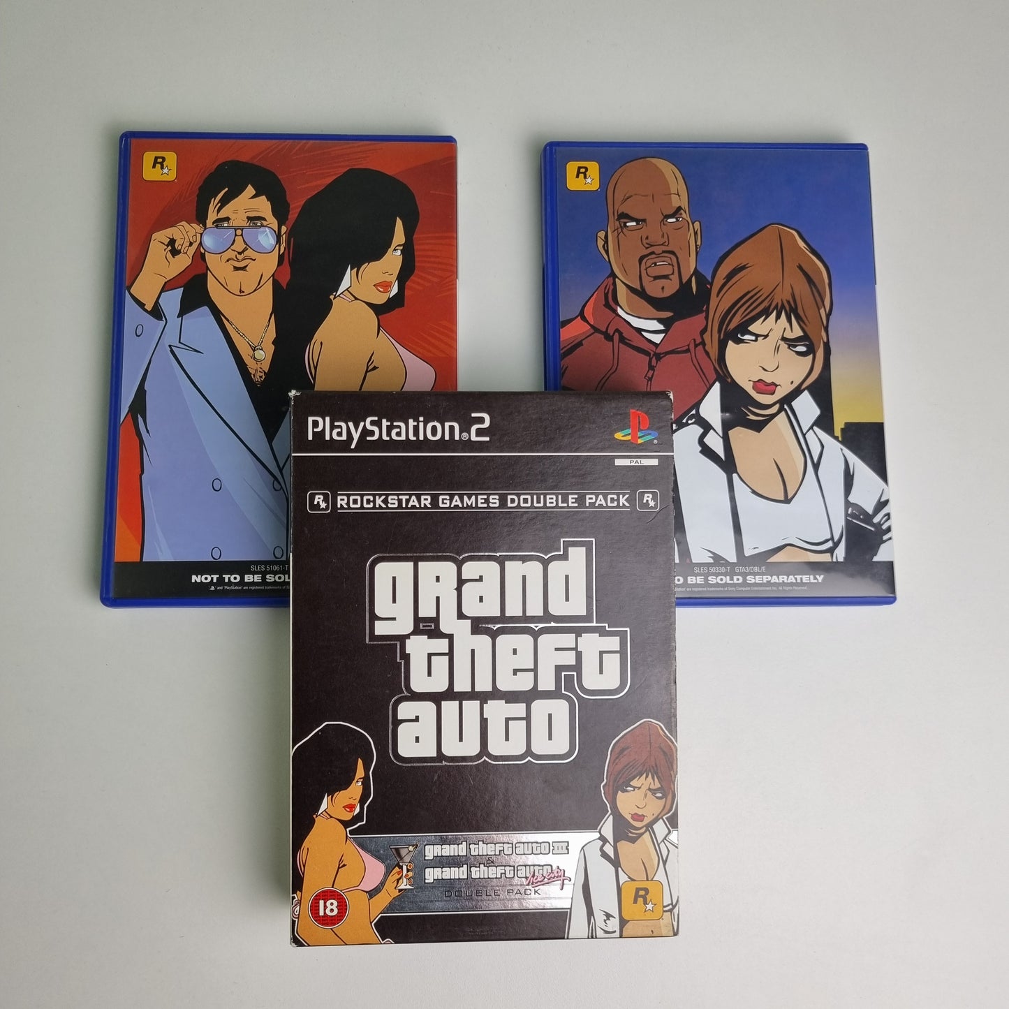 Official Sony PlayStation PS2 game disc titled 'Grand Theft Auto III & Vice City - Double Pack' with packaging on a white background