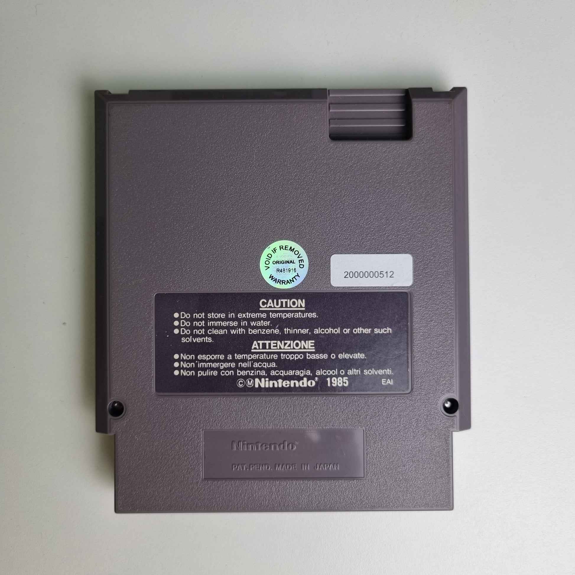 Back of a Nintendo NES game cartridge on a light grey background