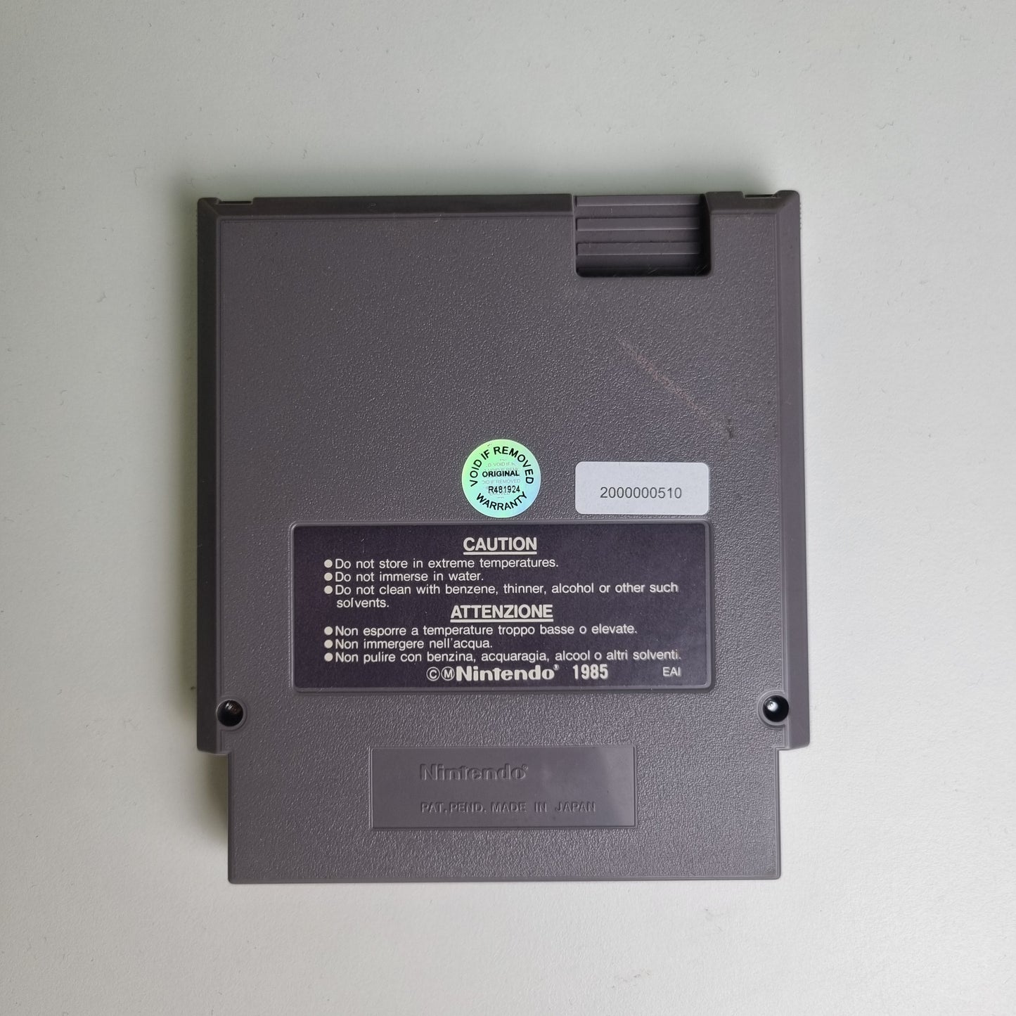 Back of a Nintendo NES game cartridge on a light grey background