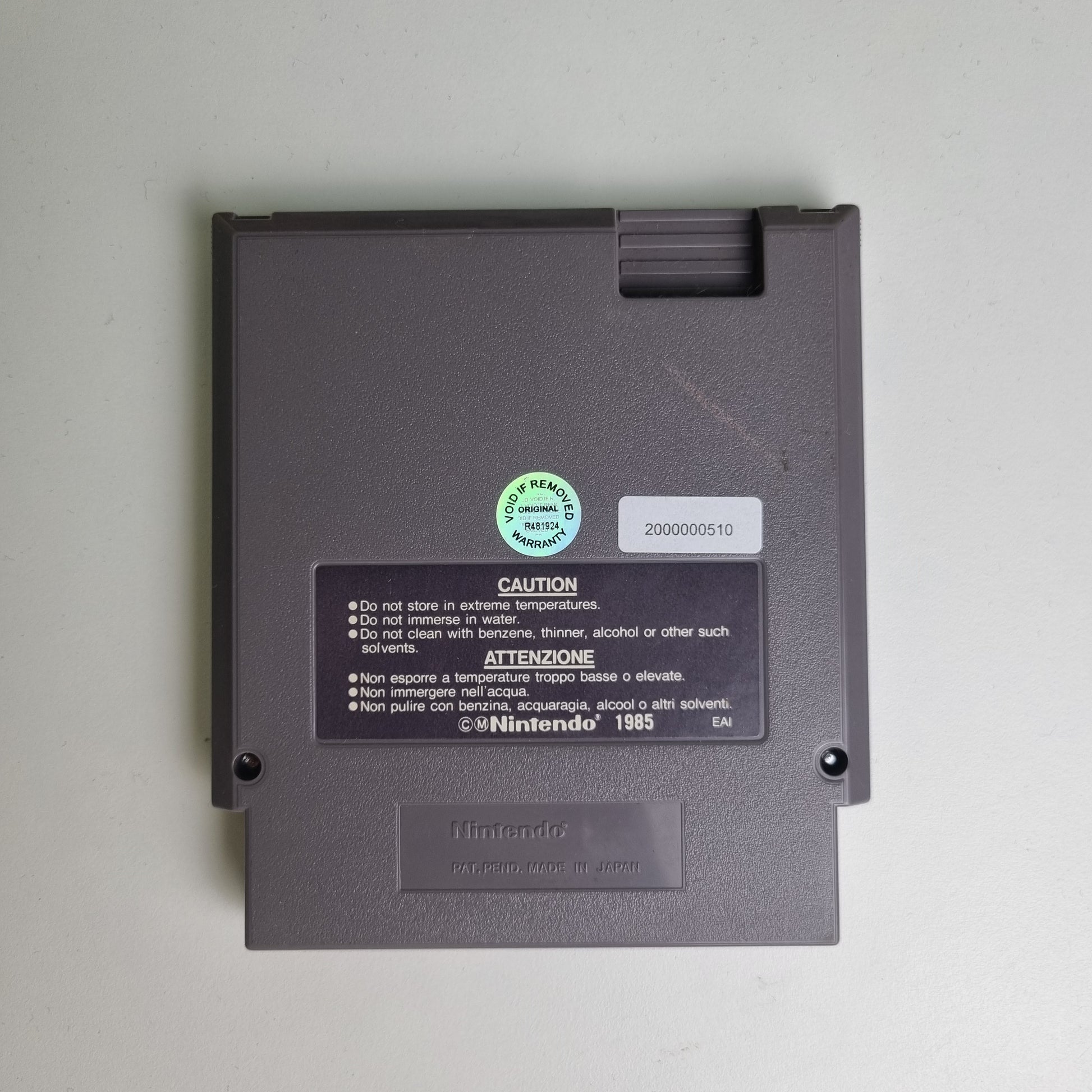 Back of a Nintendo NES game cartridge on a light grey background