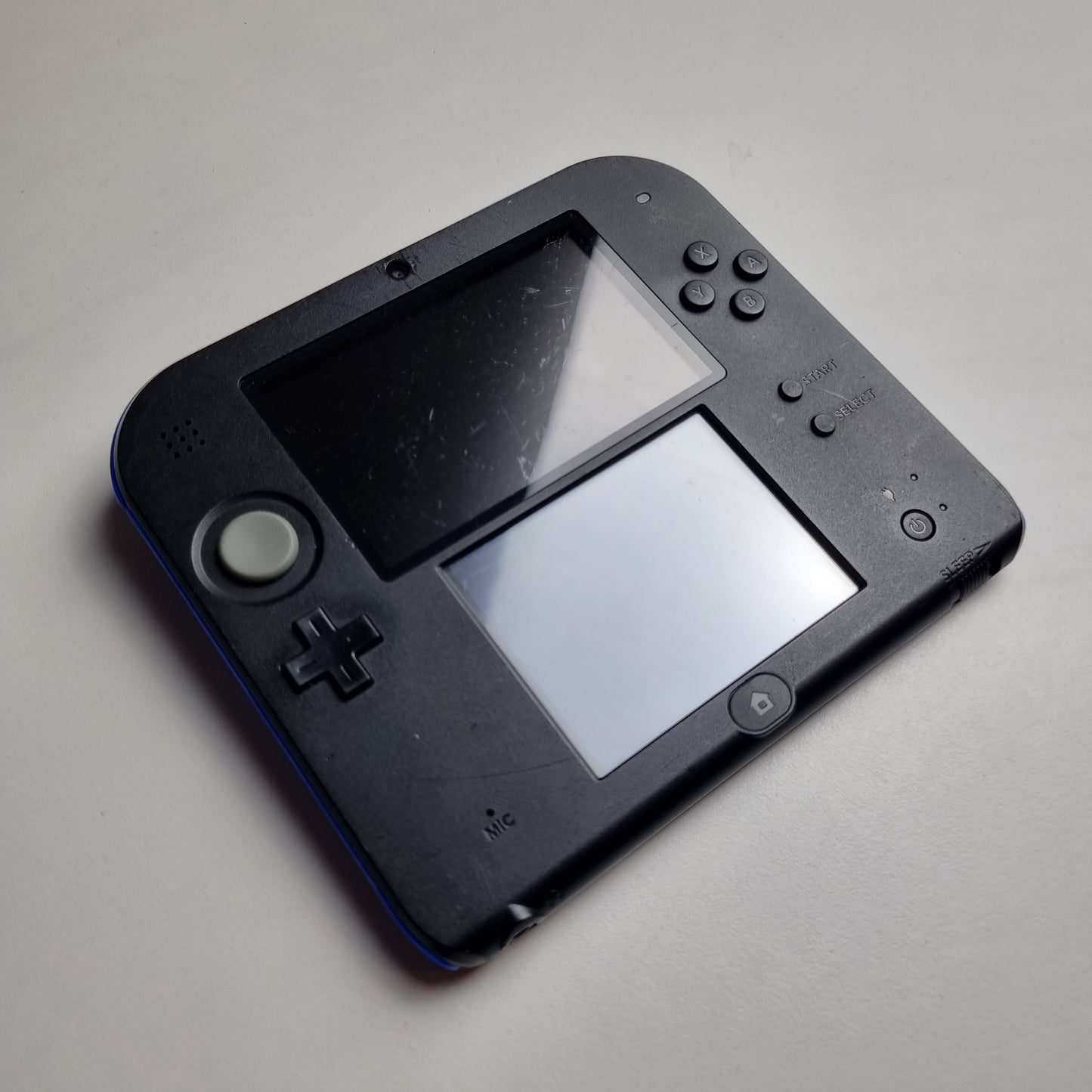Refurbished Nintendo 2DS black handheld gaming console with two screens on a light grey background