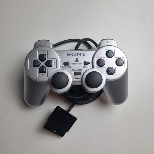 Refurbished official silver Sony PlayStation 2 wired controller, showing signs of wear and tear.
