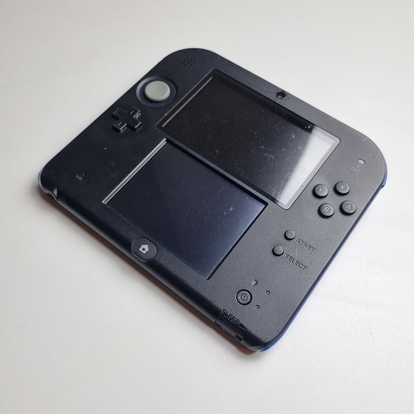 Refurbished Nintendo 2DS black handheld gaming console with two screens on a light grey background.