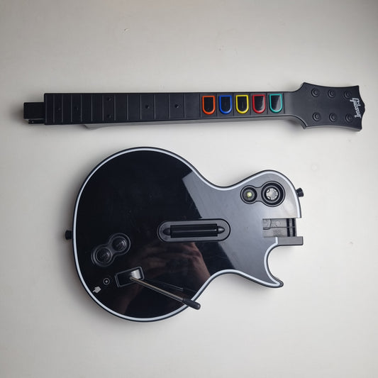 Official RedOctane Xbox 360 Gibson Les Paul black guitar controller on a white background.