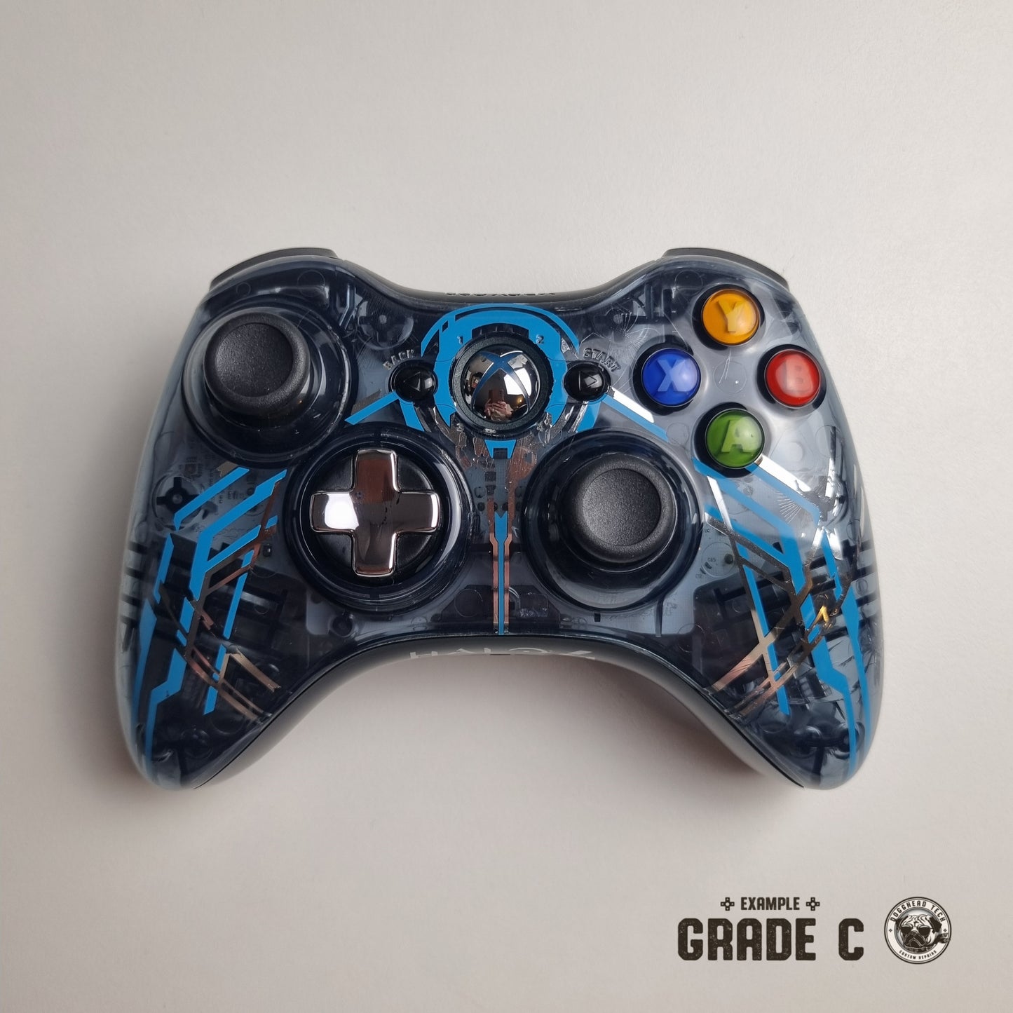 Official Xbox 360 'Halo 4: Forerunner' controller with text in the bottom right corner of the image that reads "Example Grade C".