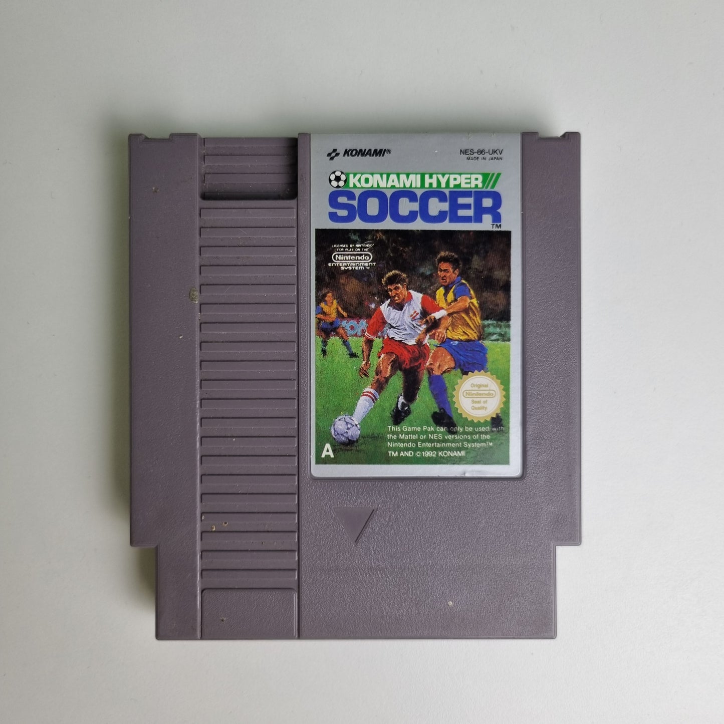 Konami Hyper Soccer game cartridge  for Nintendo NES on a light grey background