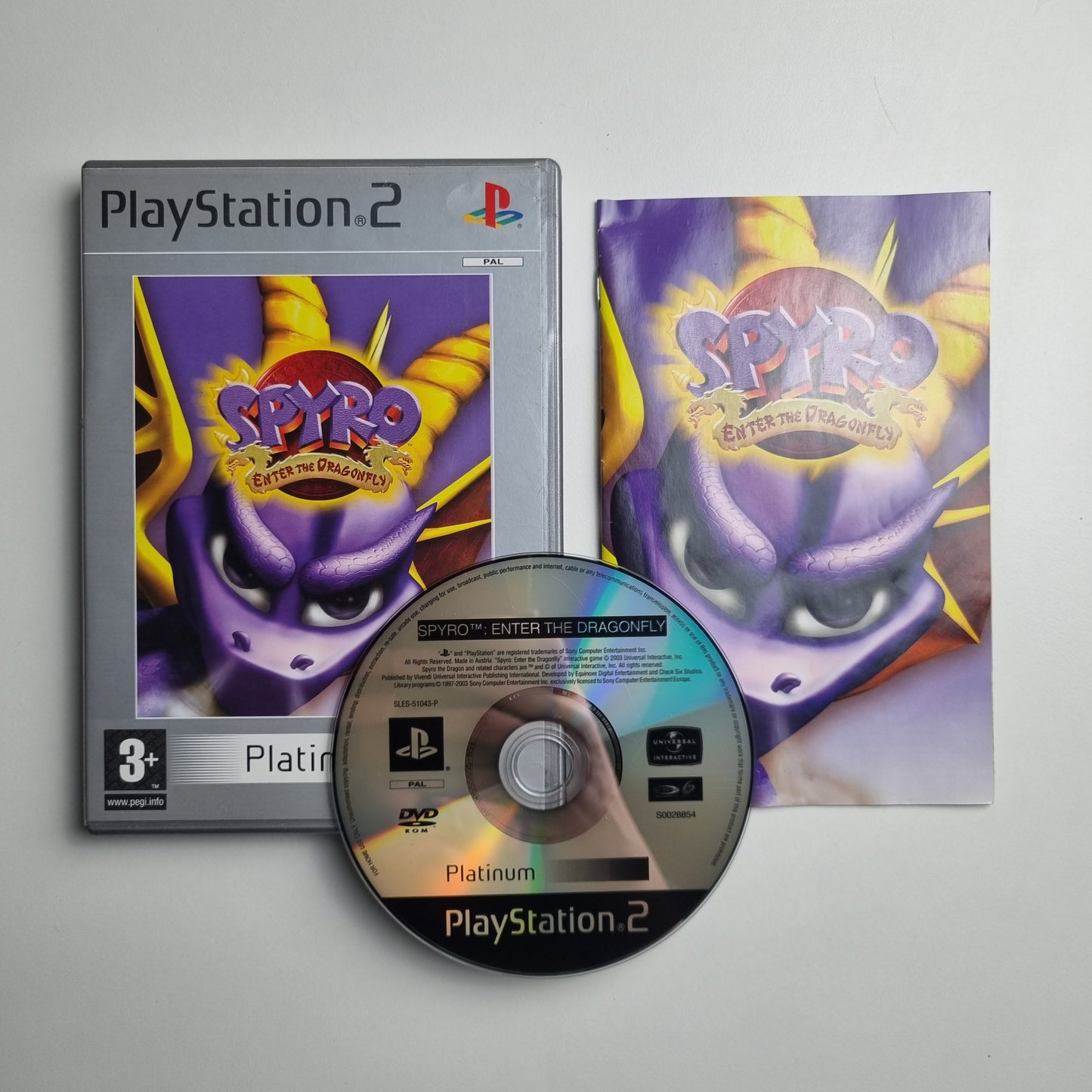 Official Sony PlayStation 2 Platinum pre-loved game titled 'Spyro: Enter The Dragonfly', with packaging and disc on a gray background 