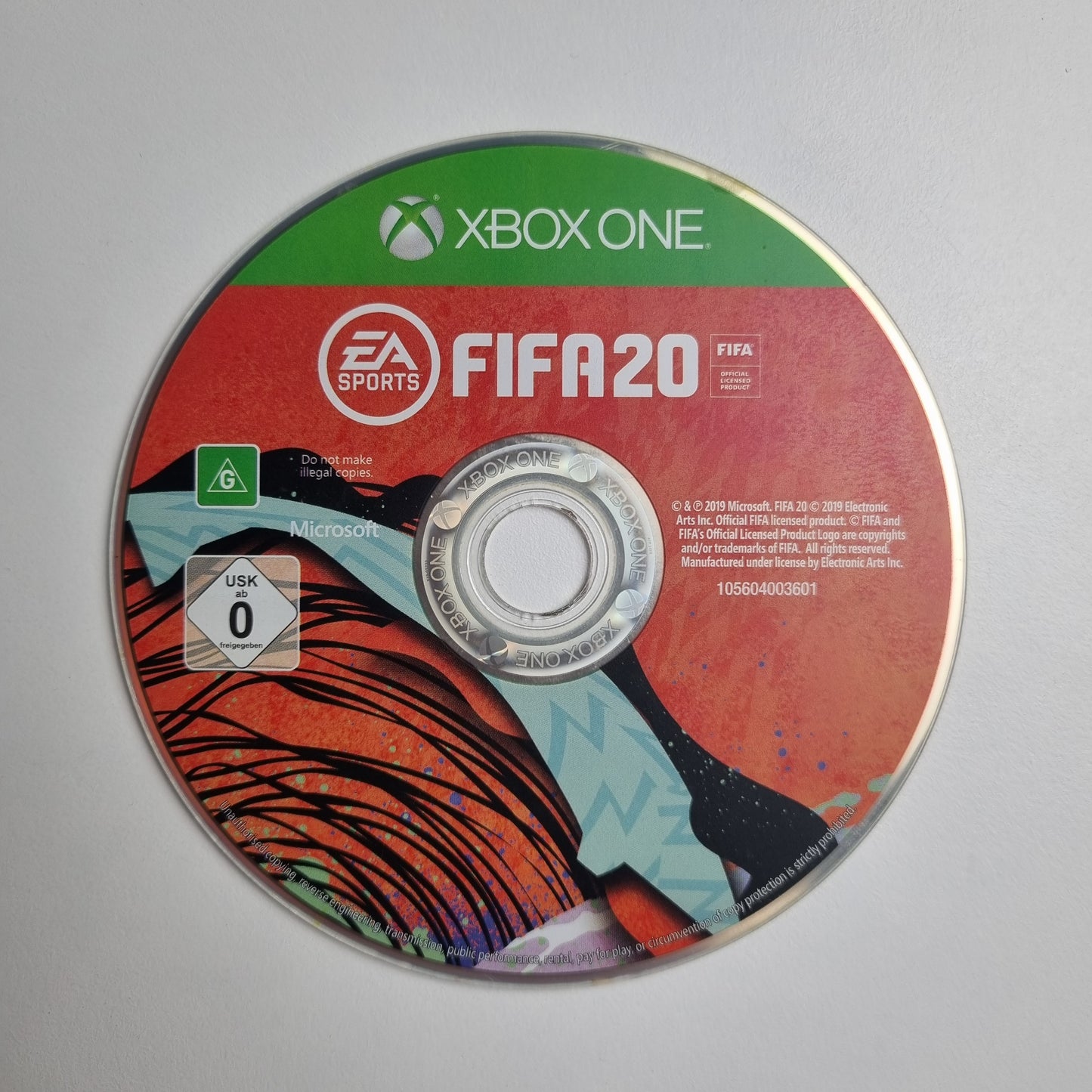 FIFA 20 game disc for Xbox One on a grey background