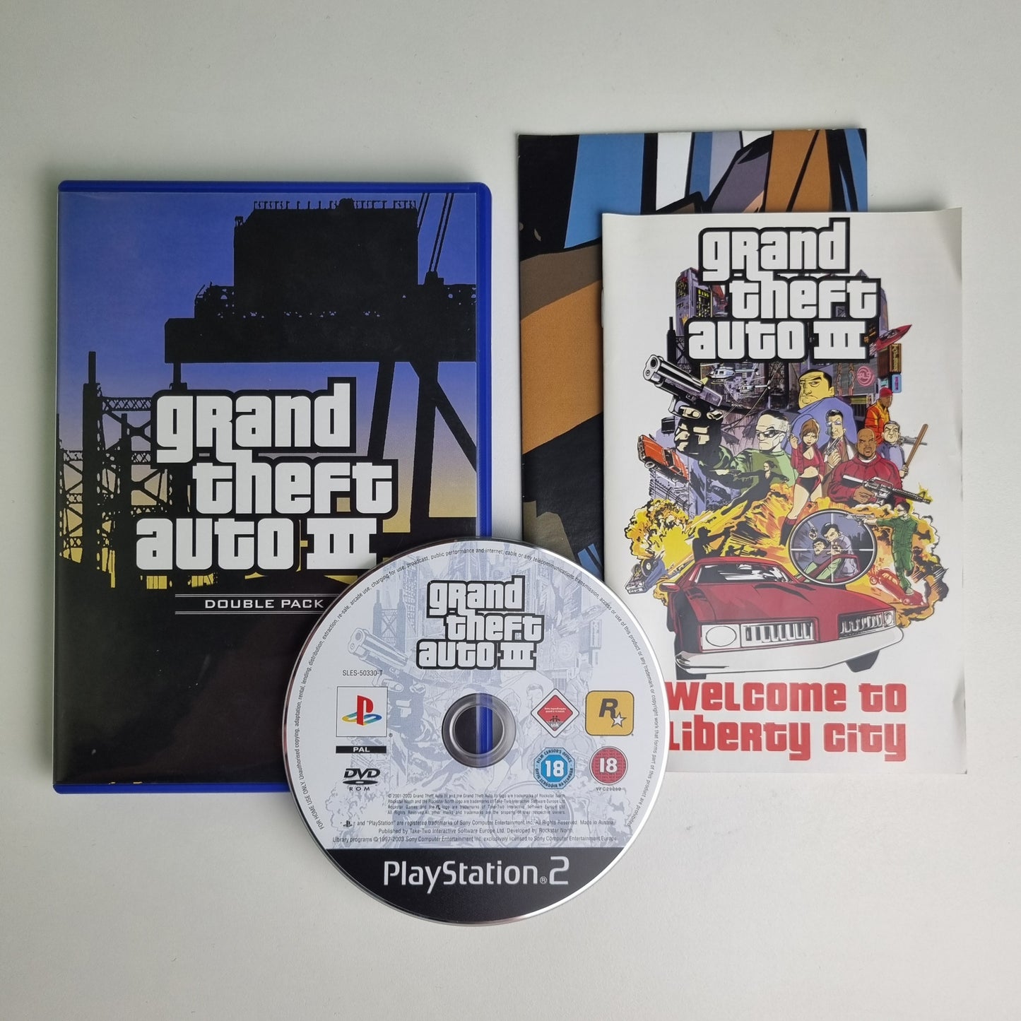 Official Sony PlayStation PS2 game disc titled 'Grand Theft Auto III & Vice City - Double Pack' with packaging on a white background