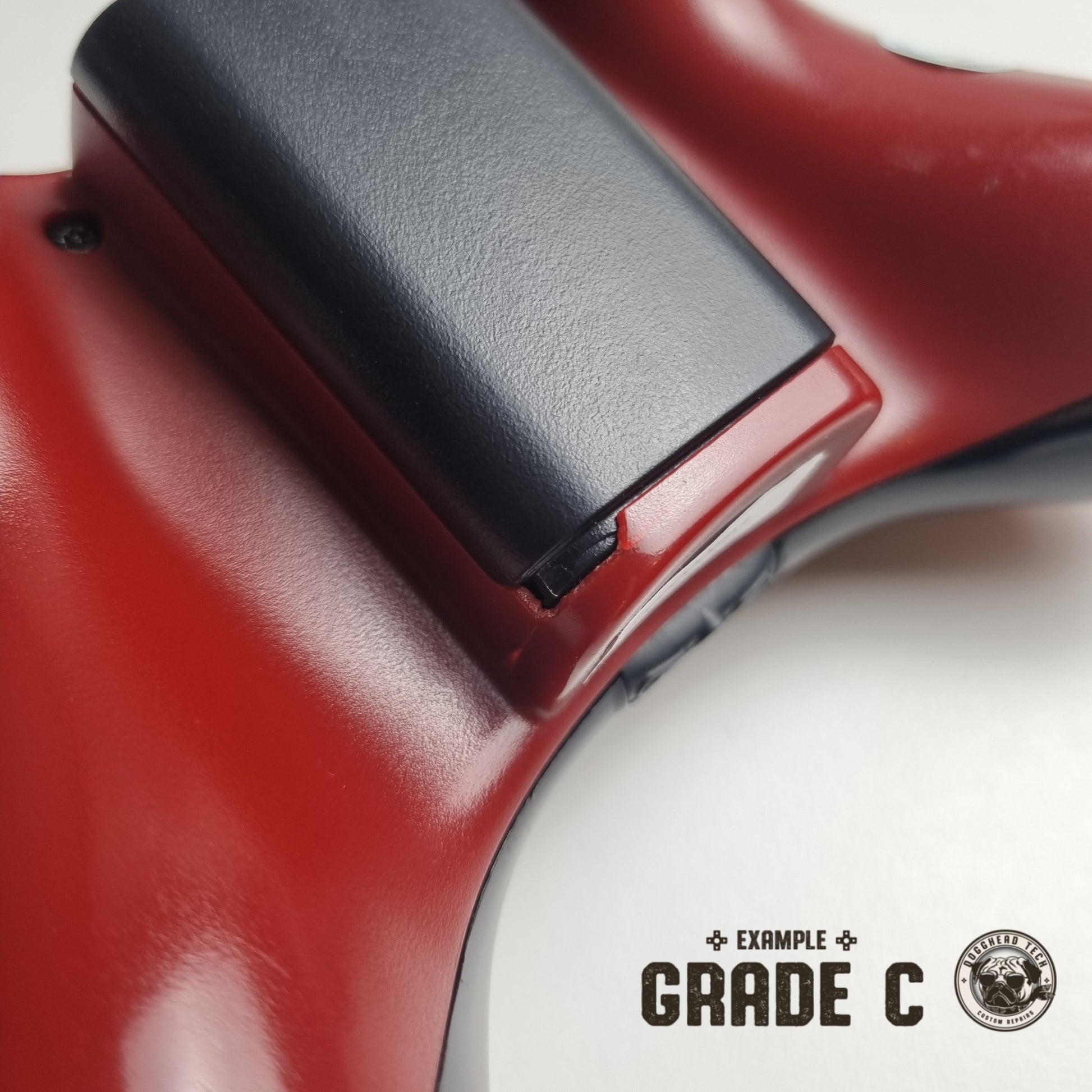 Official Xbox 360 'Gears of War 3' controller showing broken plastic with text in the bottom right corner of the image that reads "Example Grade C".