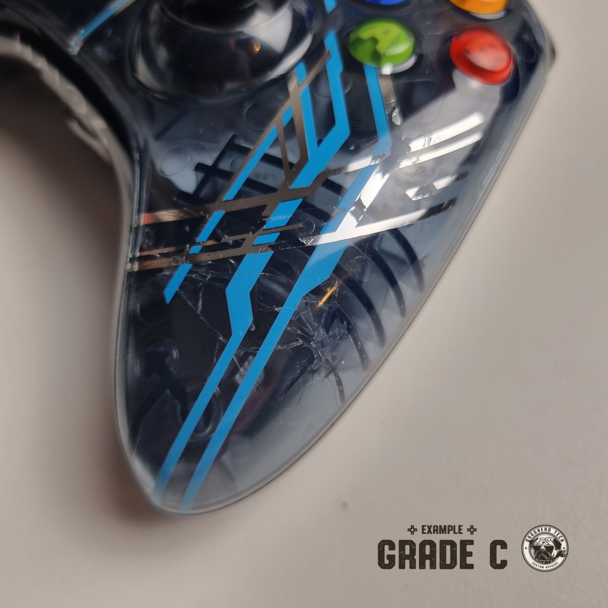 Official Xbox 360 'Halo 4: Forerunner' controller with visible cracks with text in the bottom right corner of the image that reads "Example Grade C".